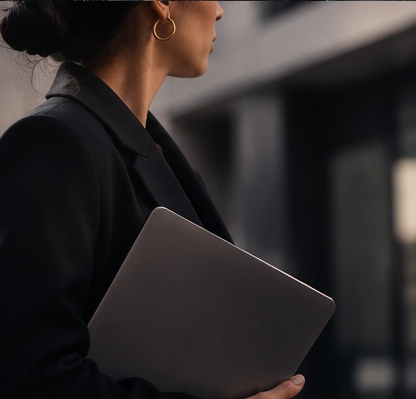 Professional finance candidate working at a laptop